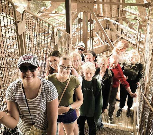 tour group climbing eiffel